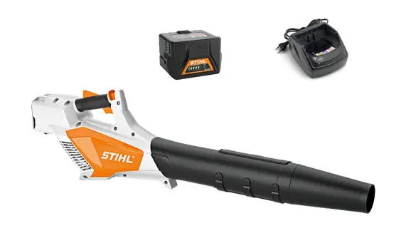 STIHL BGA 57 battery blower kit with AK 20 and AL 101 STIHL BGA 57 cordless blower side view Close-up of STIHL BGA 57 handle and trigger STIHL BGA 57 adjustable blower tube detail STIHL BGA 57 in use clearing leaves from a driveway